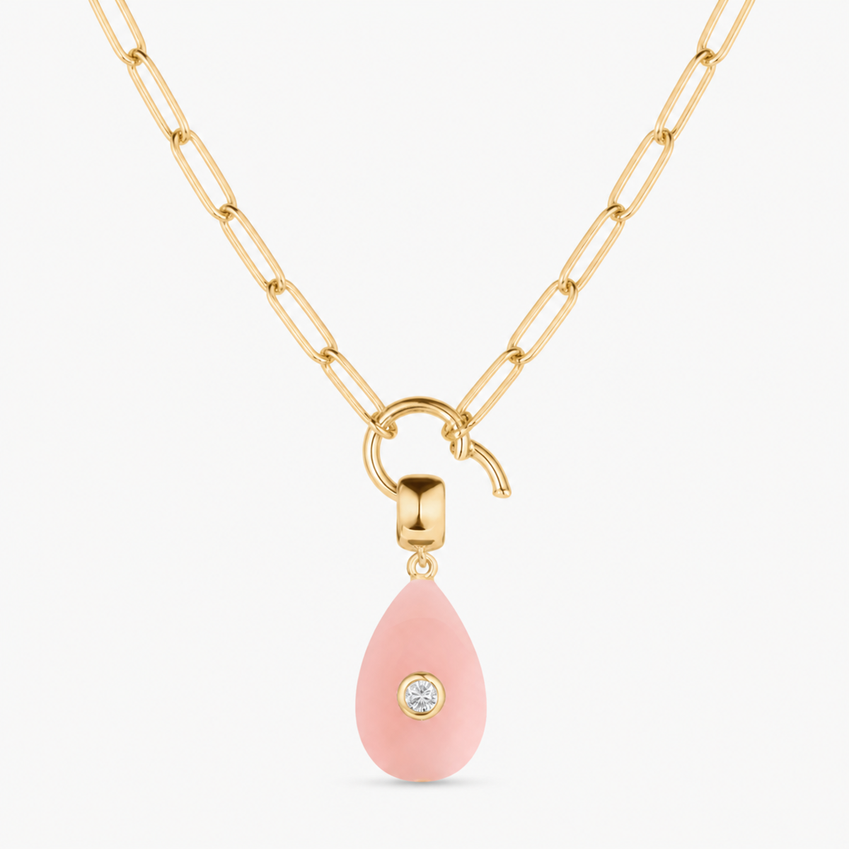 pink jade smooth teardrop charm shown on a gold paperclip charm necklace