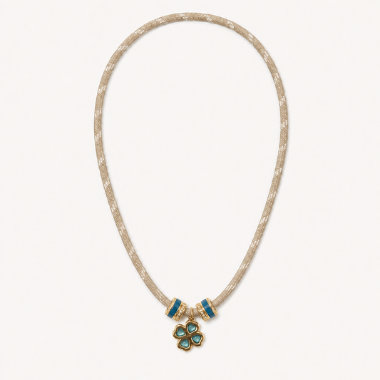 Cream cord necklace with turquoise clover pendant and centered spacer rings