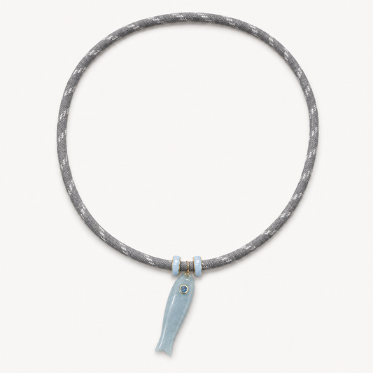 Gray cord necklace with blue jade fish pendant and centered spacer rings