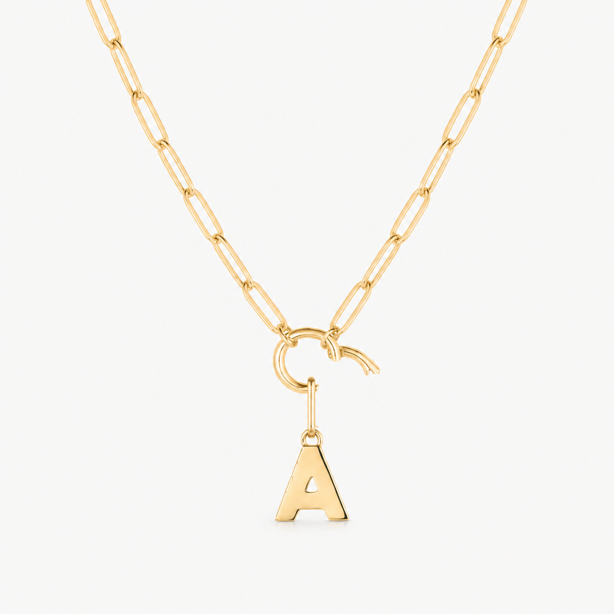 initial charm shown on a gold paperclip charm necklace