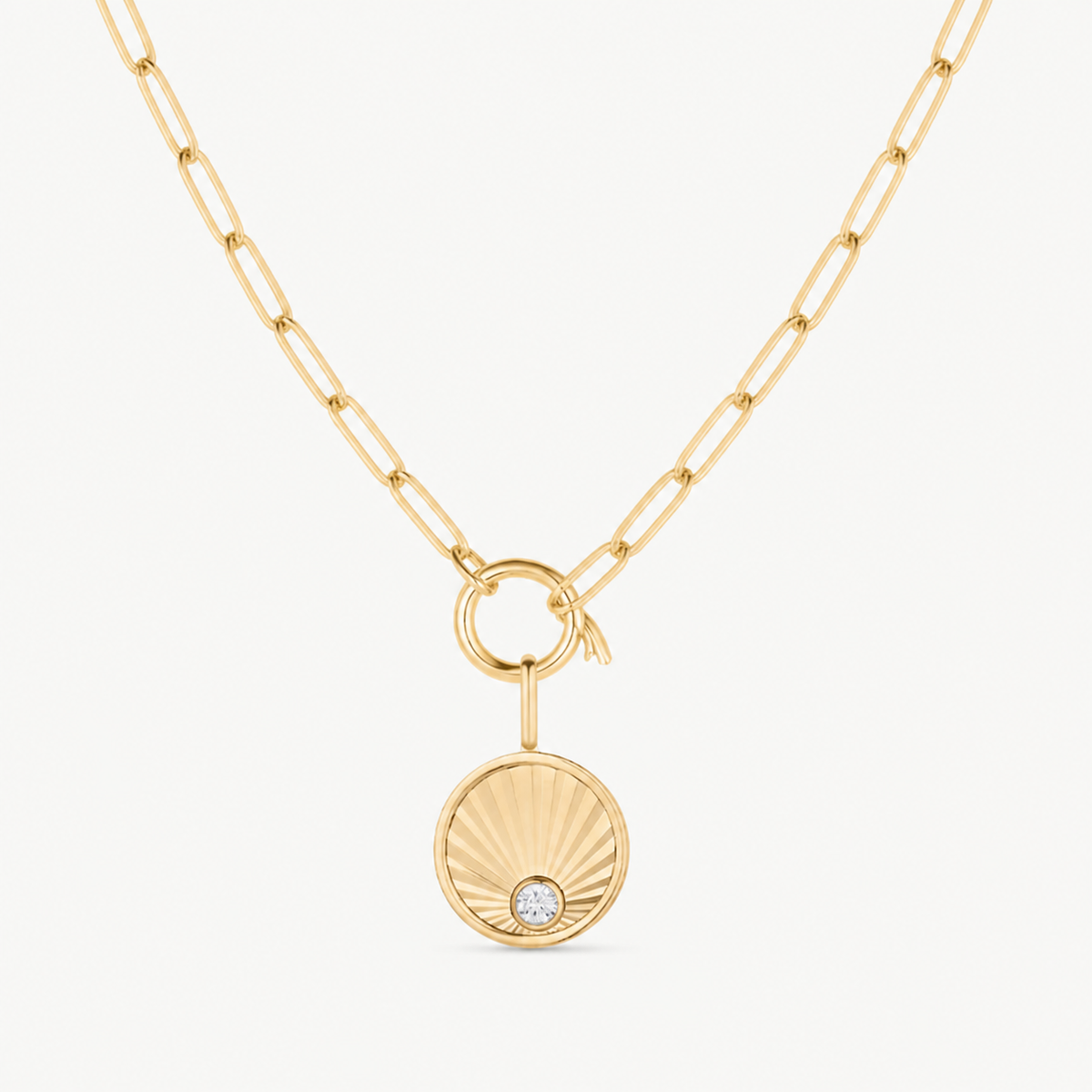 birth of venus round charm shown on a gold paperclip charm necklace