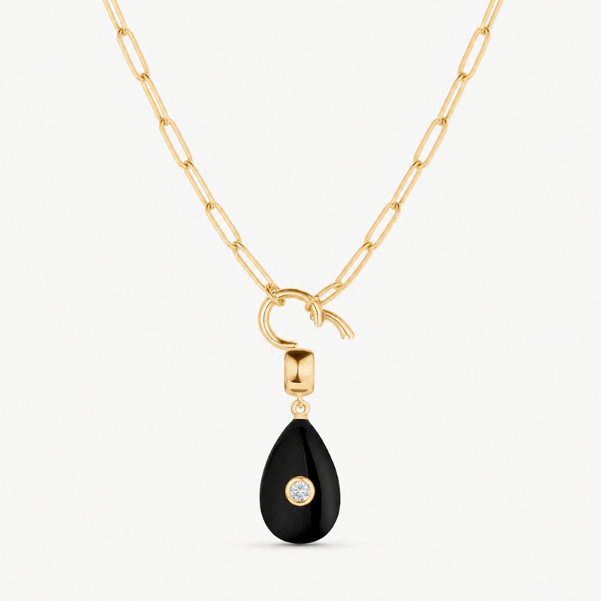 black onyx smooth teardrop charm shown on a gold paperclip charm necklace