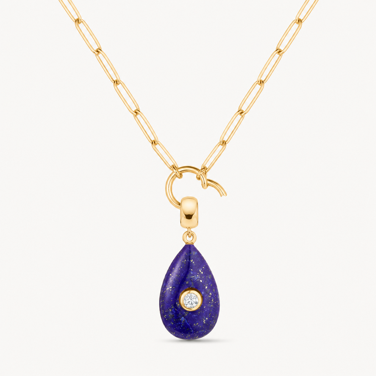 blue lapis smooth teardrop charm shown on a gold paperclip charm necklace