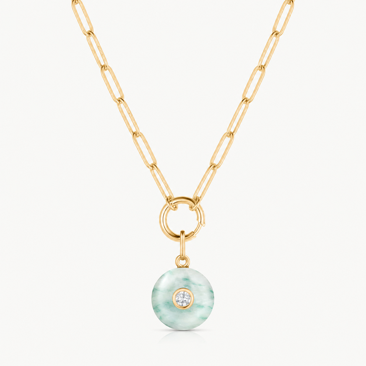 green dot smooth round charm shown on a gold paperclip charm necklace