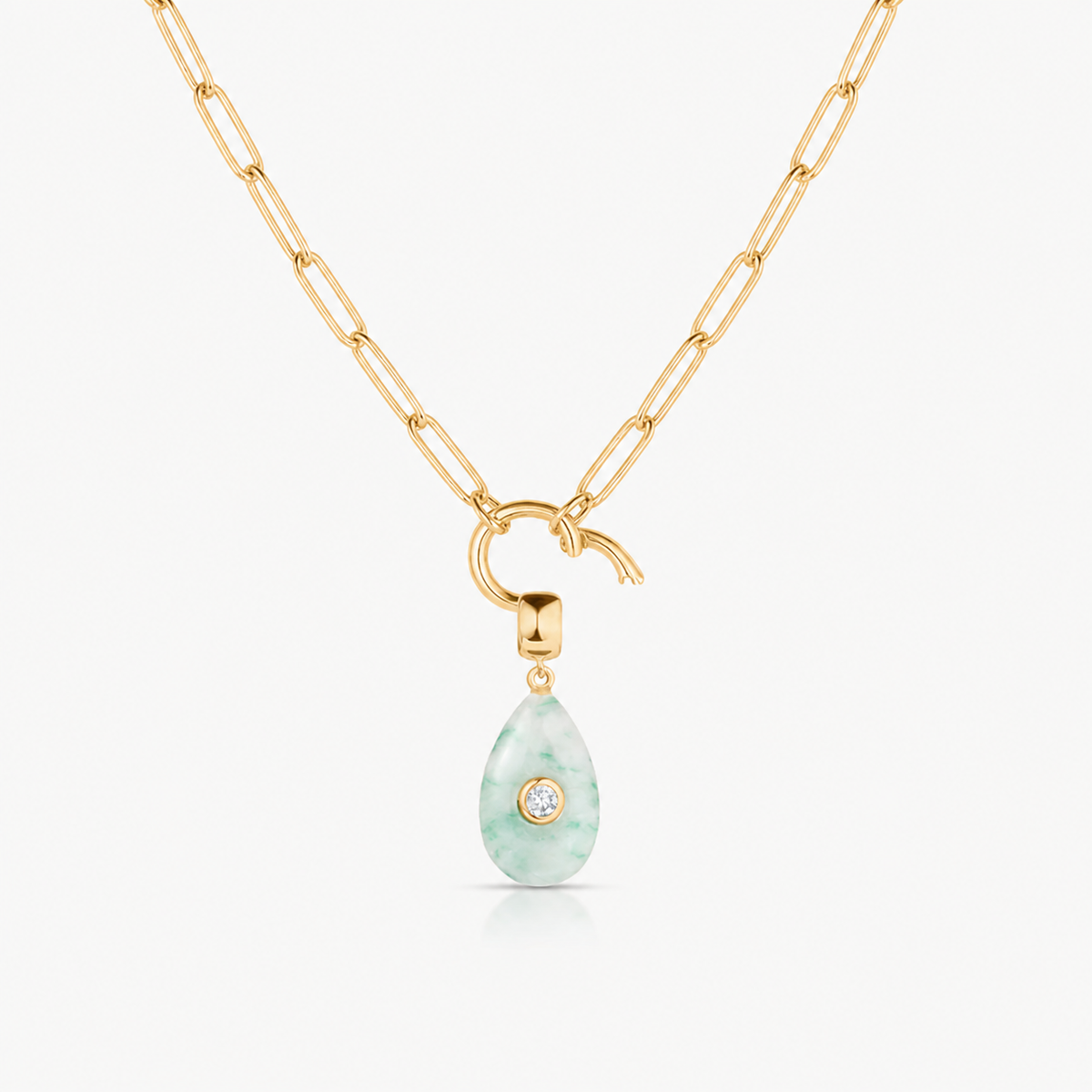 green dot smooth teardrop charm shown on a gold paperclip charm necklace