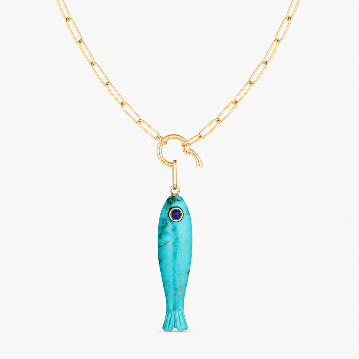 howlite fish charm shown on a gold paperclip charm necklace