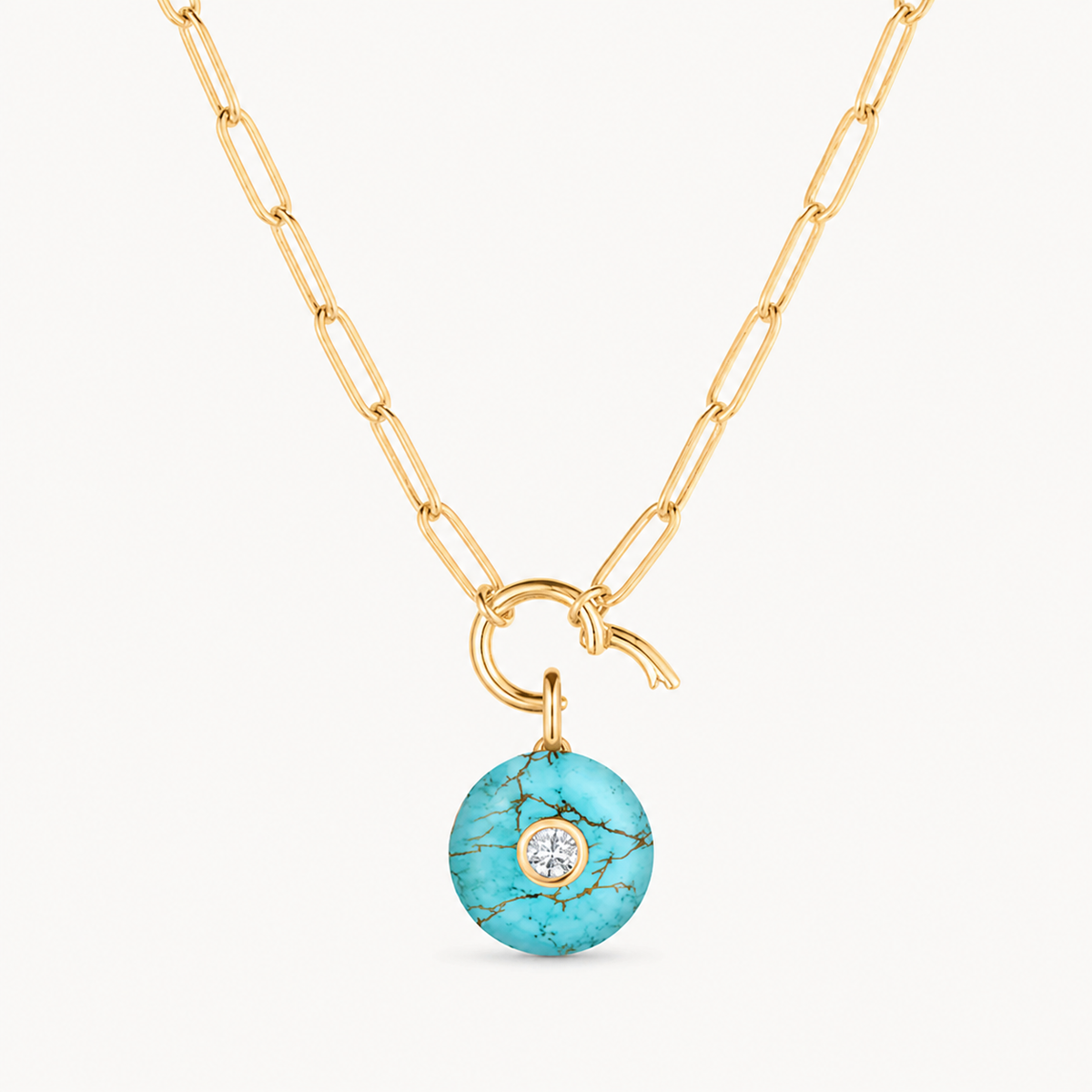 howlite smooth round charm shown on a gold paperclip charm necklace