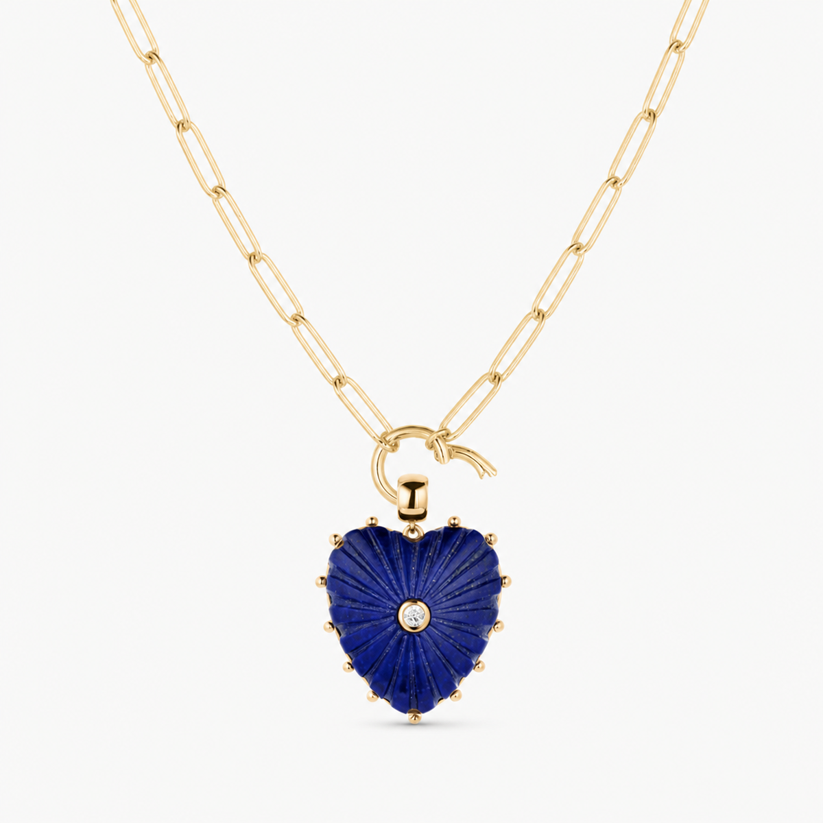 lapis carved heart charm shown on a gold paperclip charm necklace