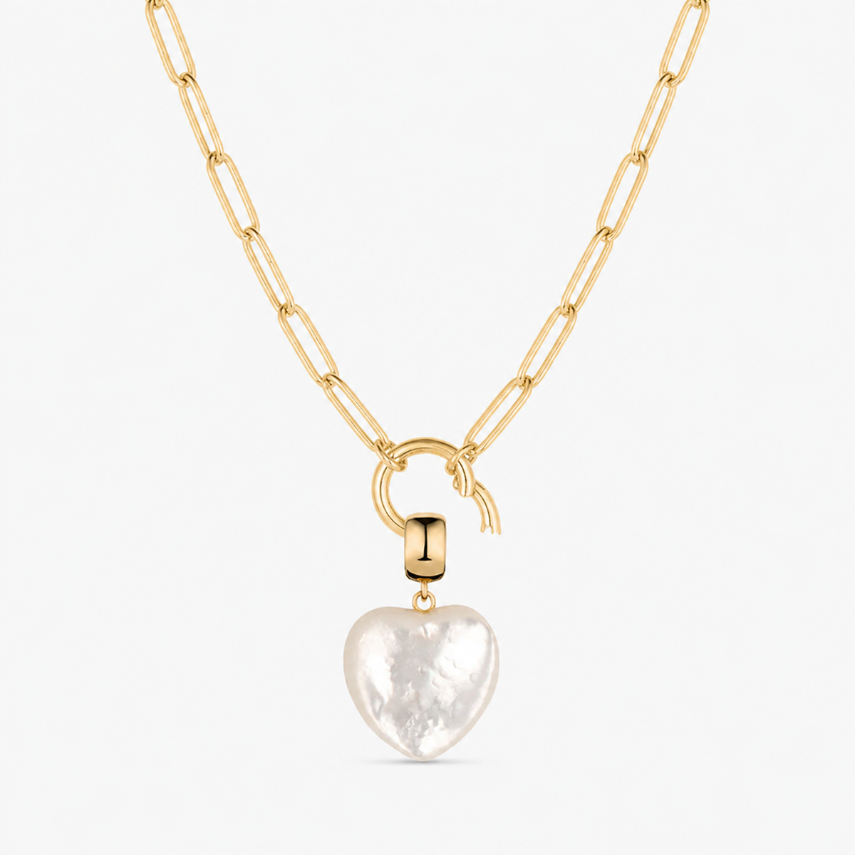 mother of pearl small smooth heart charm shown on a gold paperclip charm necklace