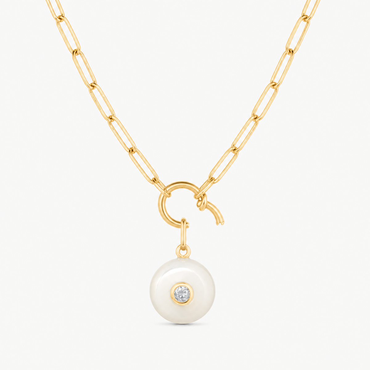 mother of pearl smooth round charm shown on a gold paperclip charm necklace