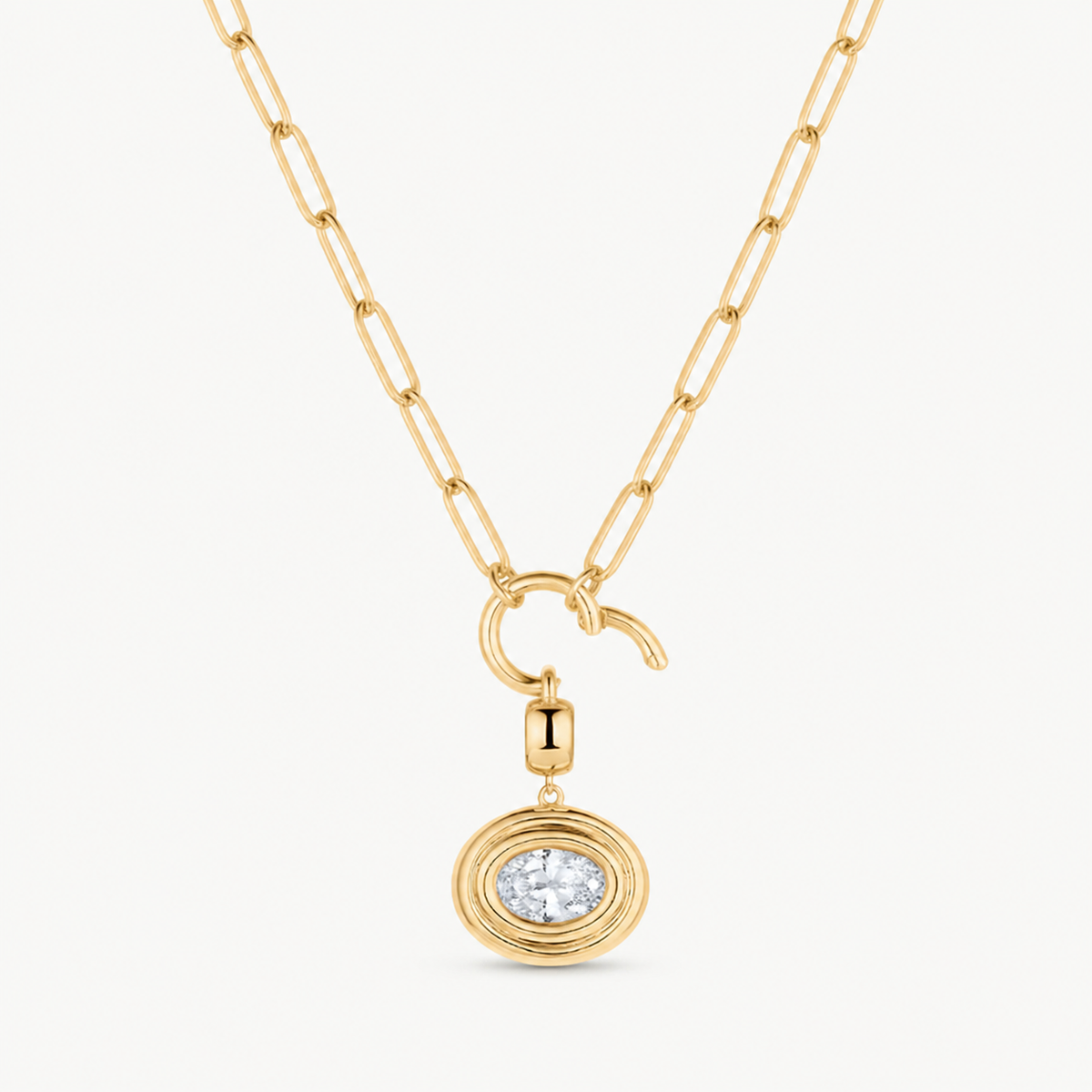 oval cubic zirconia charm shown on a gold paperclip charm necklace