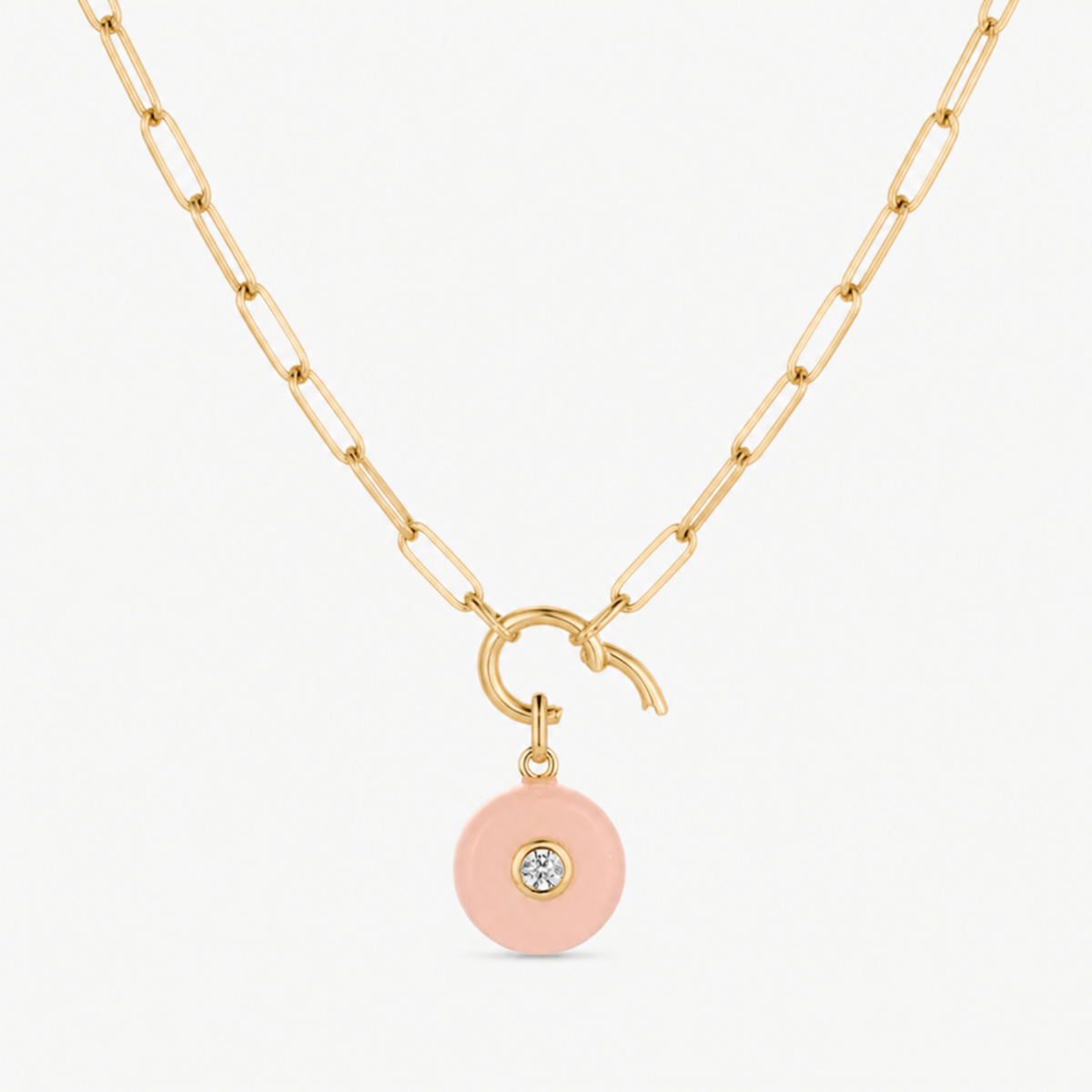 pink jade smooth round charm shown on a gold paperclip charm necklace