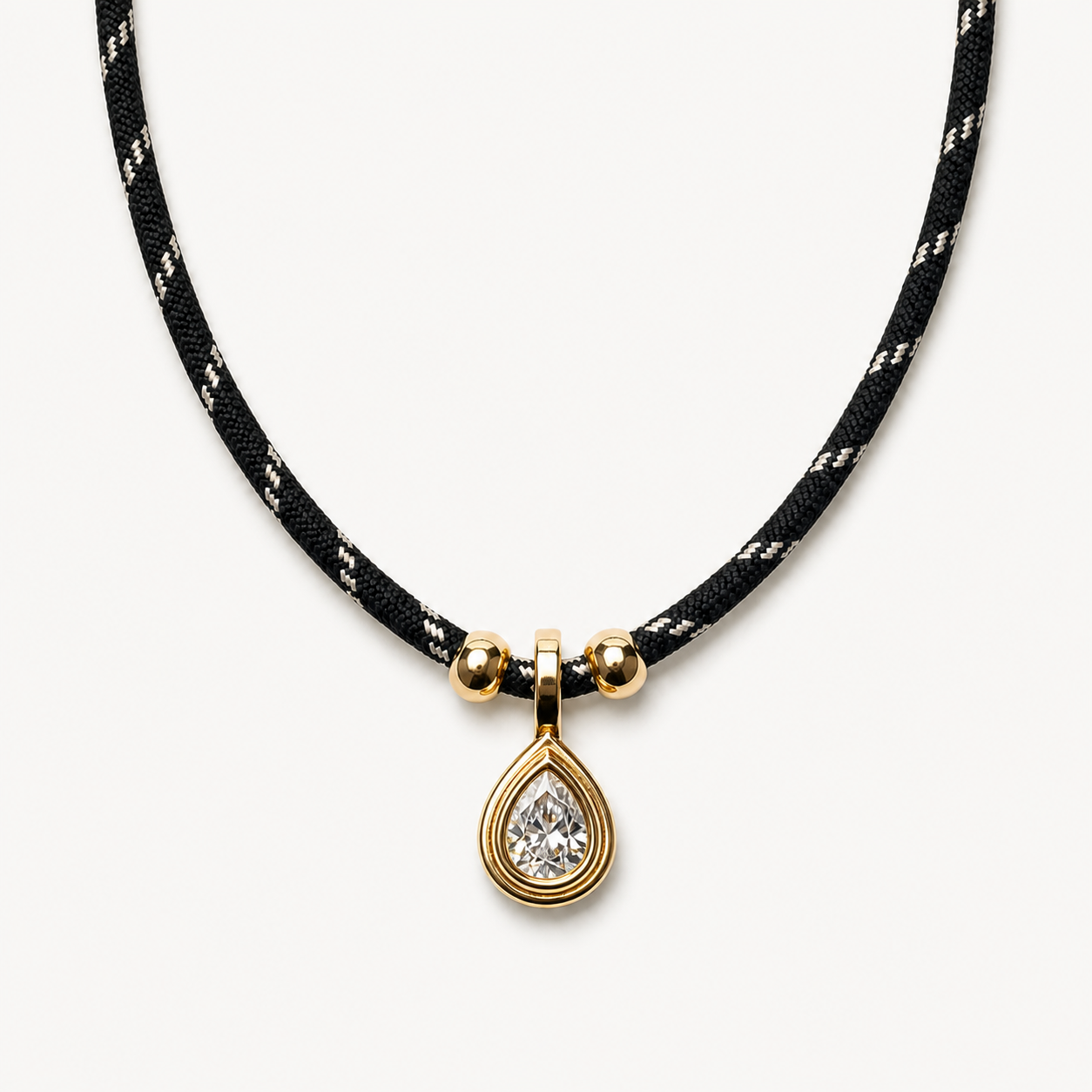 Black cord crystal teardrop necklace in a clean pendant-forward presentation