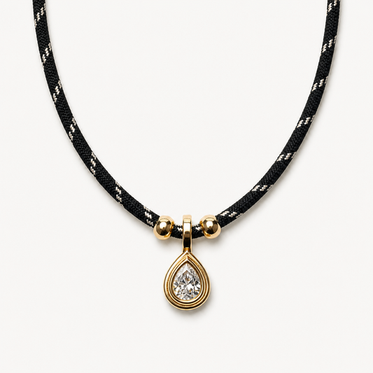 Black cord crystal teardrop necklace in a clean pendant-forward presentation