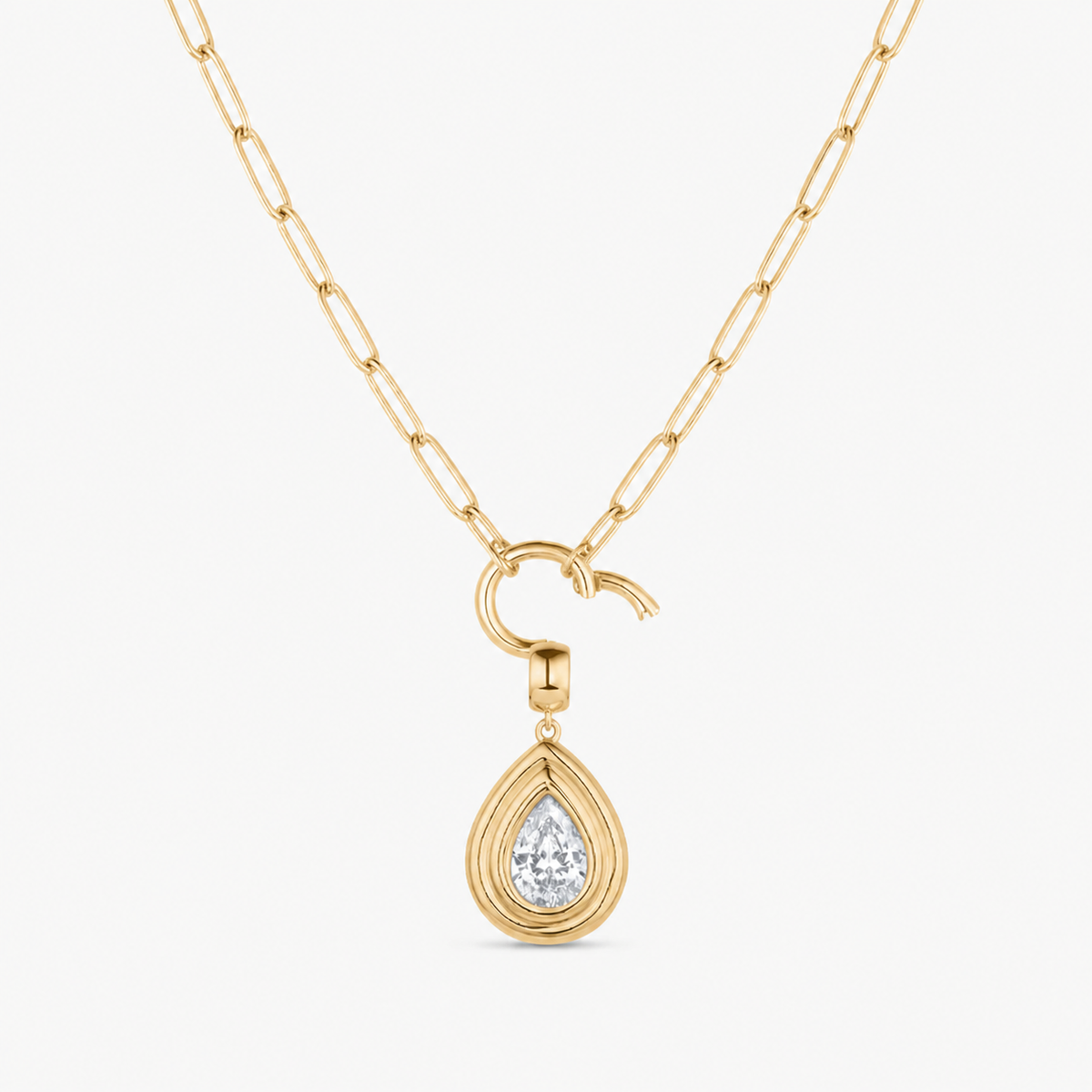 teardrop cubic zirconia charm shown on a gold paperclip charm necklace