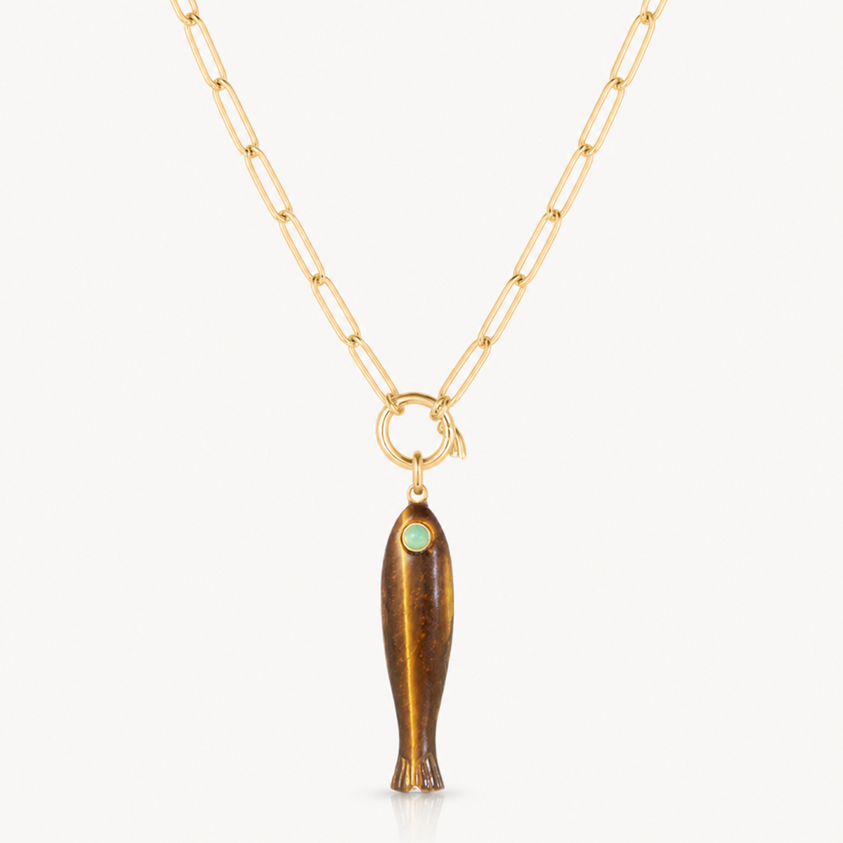 tiger eye fish charm shown on a gold paperclip charm necklace