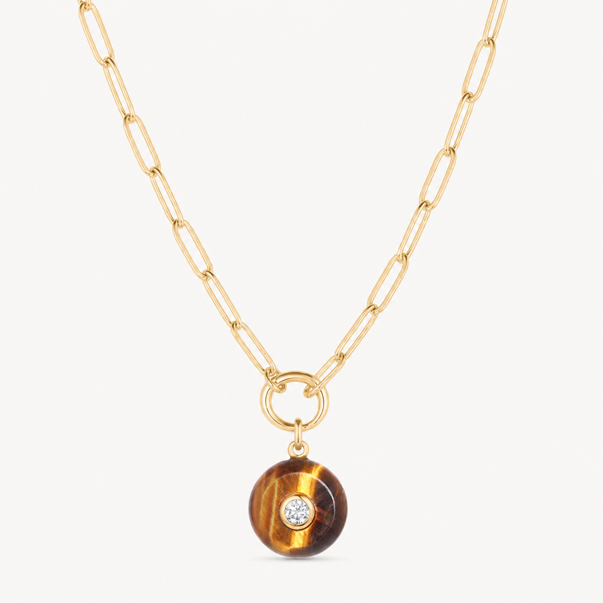 tiger eye smooth round charm shown on a gold paperclip charm necklace